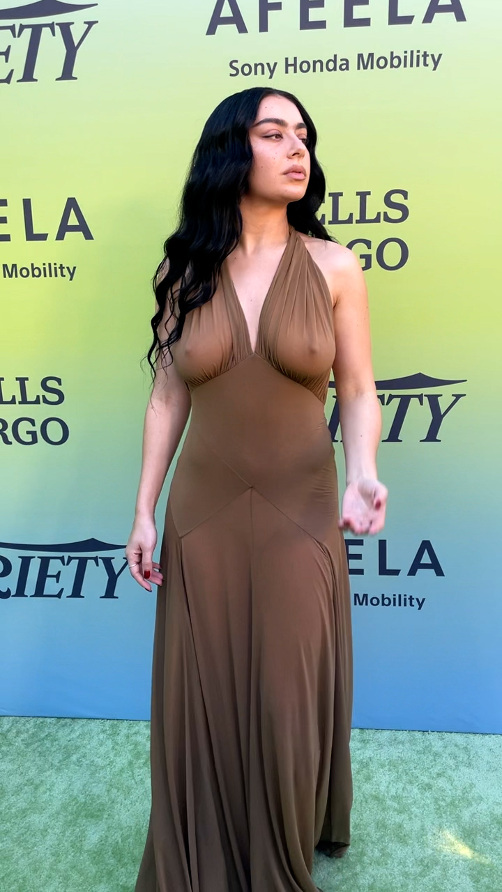 Charli XCX in a sheer dress in a subdued olive green color (1).jpg