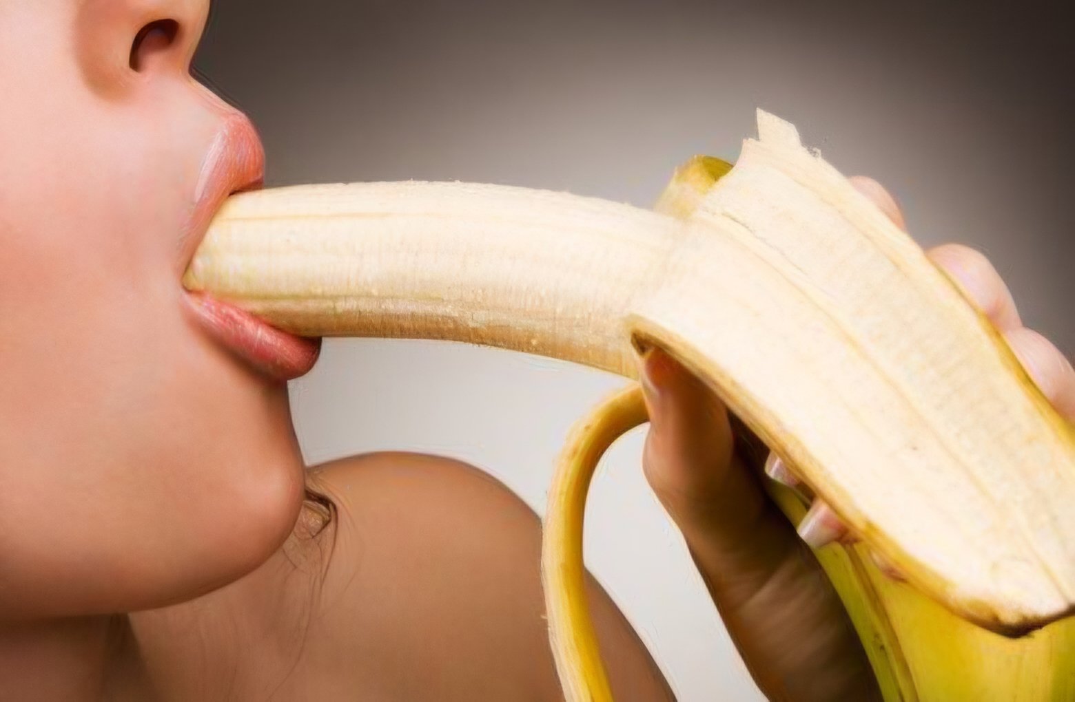 young-woman-eating-banana-own-260nw-35006347.jpg